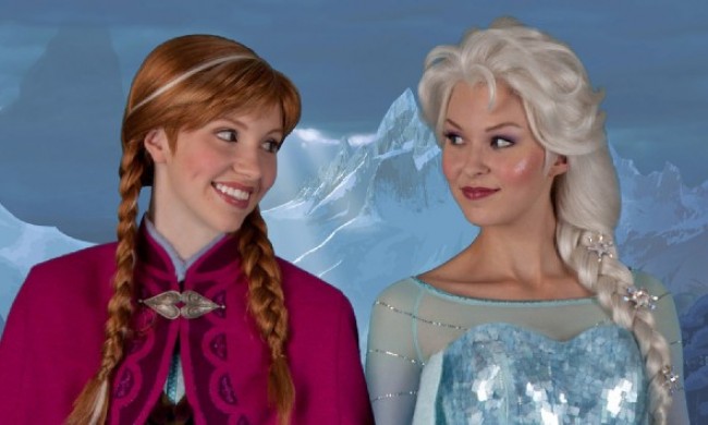 Frozen's Anna and Elsa wait to greet fans at Walt Disney World in Orlando, Florida.